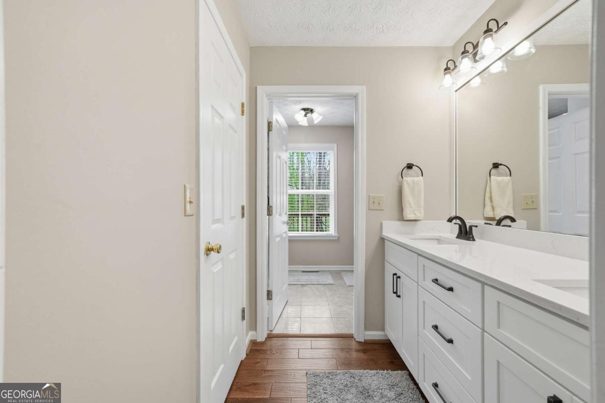 134 Nicholson Lane Talking Rock, GA 30175 - Photo 27 of 72 a spacious bathroom with a double vanity sink and mirror