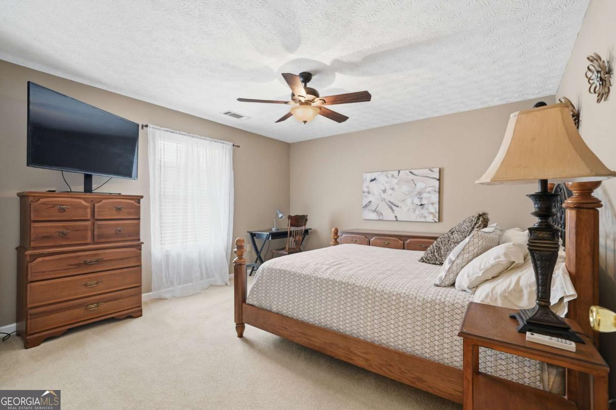 134 Nicholson Lane Talking Rock, GA 30175 - Photo 33 of 72 a bedroom with a bed and a television