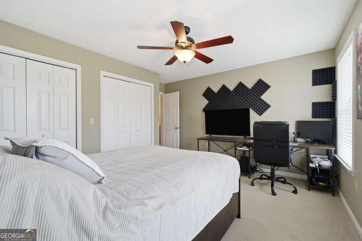 134 Nicholson Lane Talking Rock, GA 30175 - Photo 39 of 72 a bedroom with a bed and a chandelier