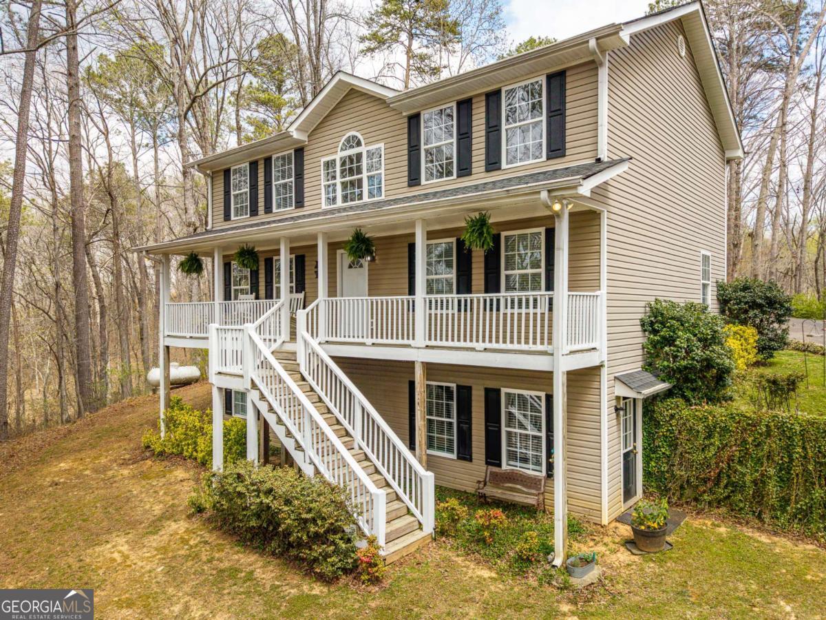 134 Nicholson Lane Talking Rock, GA 30175 - Photo 54 of 72 a front view of a house with a yard