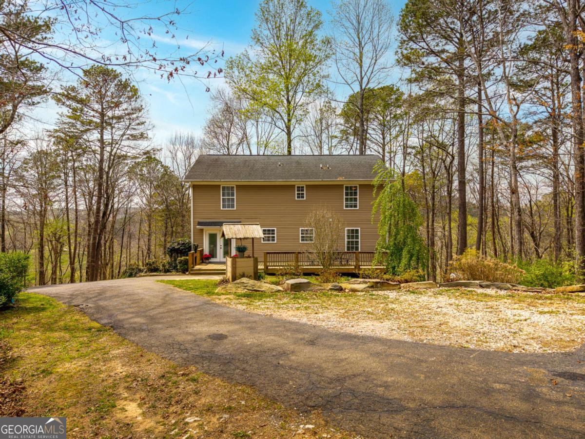 134 Nicholson Lane Talking Rock, GA 30175 - Photo 59 of 72 a view of a house with backyard area and trees