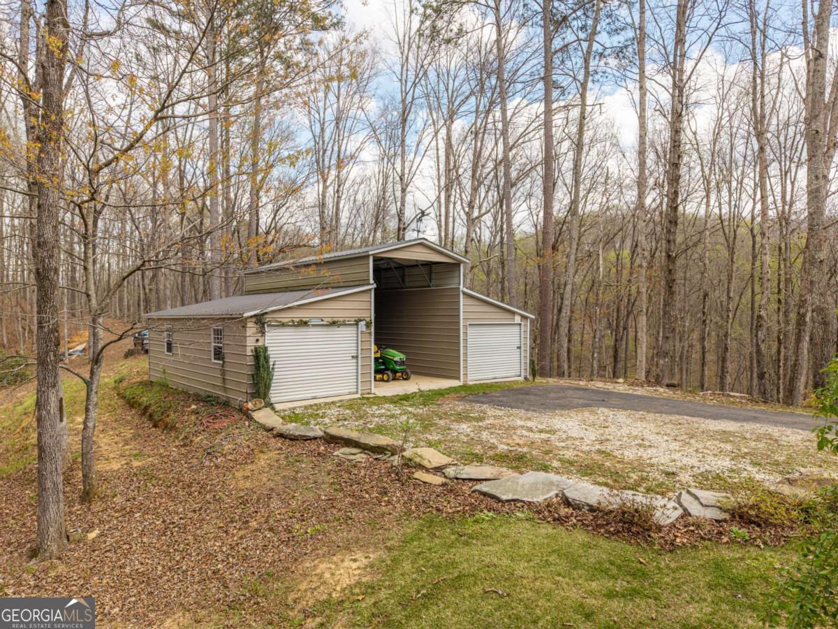 134 Nicholson Lane Talking Rock, GA 30175 - Photo 62 of 72 a view of a backyard of the house