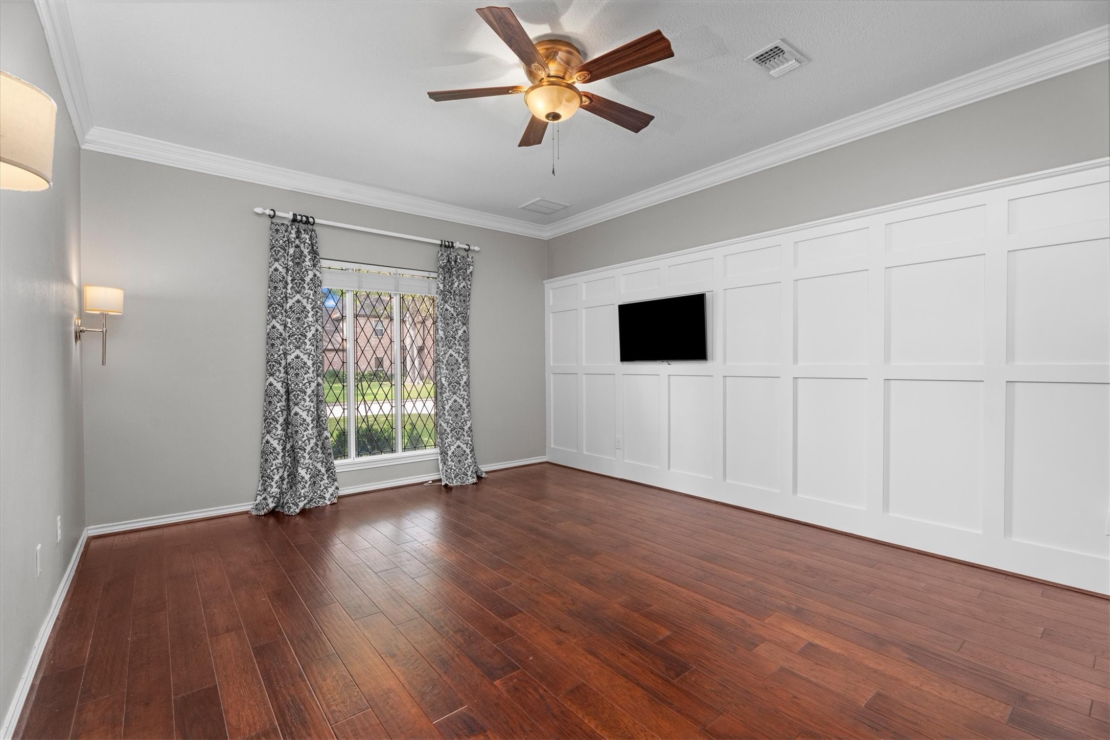 16267 Salmon Lane Spring, TX 77379 - Photo 22 of 48 The primary suite features leaded glass windows, crown molding, and a classic accent wall, with room for all your furniture.