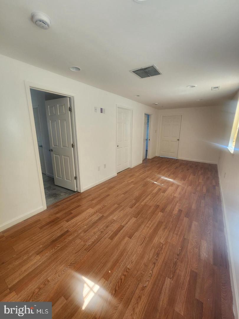 281 Spruce Street Bridgeton, NJ 08302 - Photo 11 of 18 a view of an empty room and wooden floor