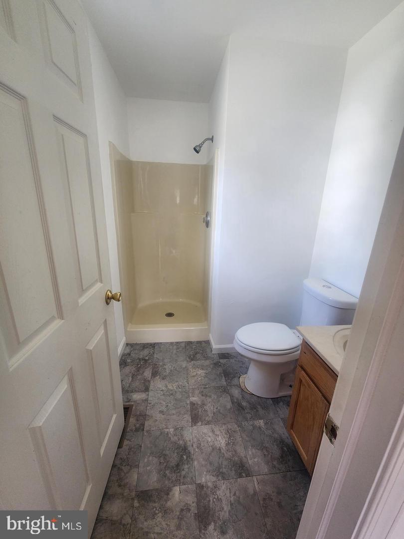 281 Spruce Street Bridgeton, NJ 08302 - Photo 12 of 18 a bathroom with a toilet and a shower