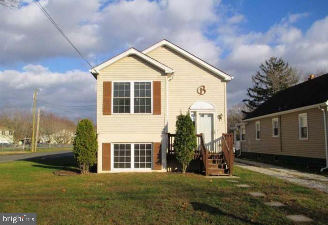 281 Spruce Street Bridgeton, NJ 08302 - Photo 18 of 18 a front view of a house with a yard