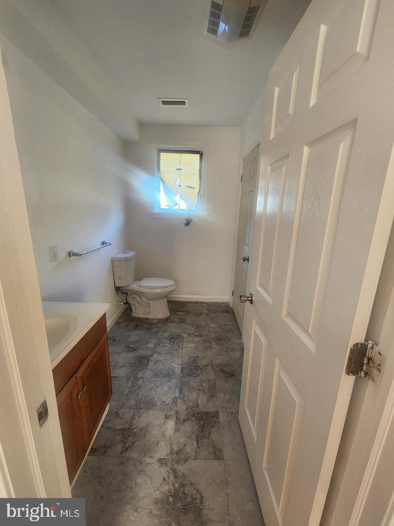 281 Spruce Street Bridgeton, NJ 08302 - Photo 5 of 18 a bathroom with a sink and a toilet