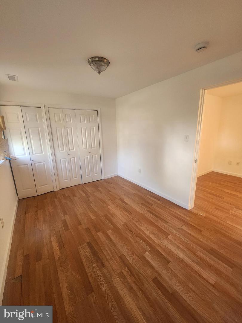 281 Spruce Street Bridgeton, NJ 08302 - Photo 8 of 18 a view of empty room with wooden floor