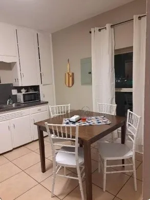 a view of a dining room with furniture