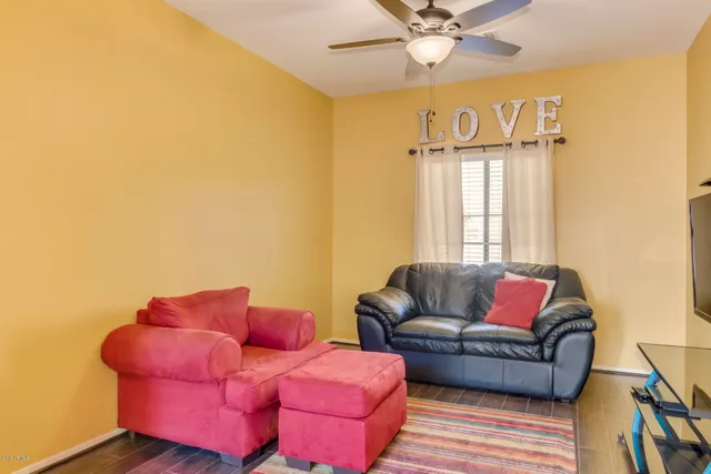 a living room with furniture and a window