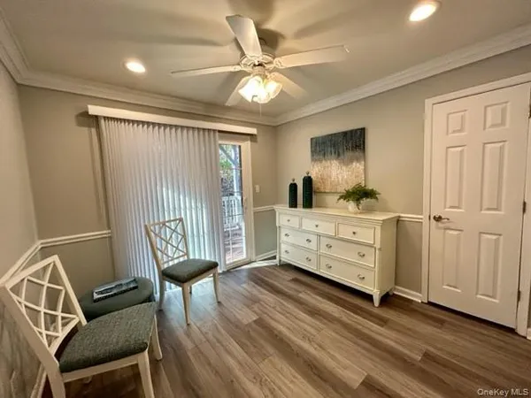 a bedroom with furniture and wooden floor