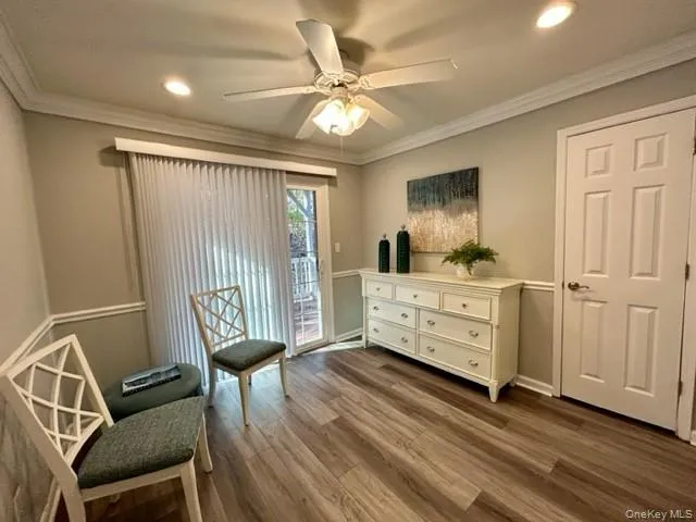 a bedroom with furniture and wooden floor