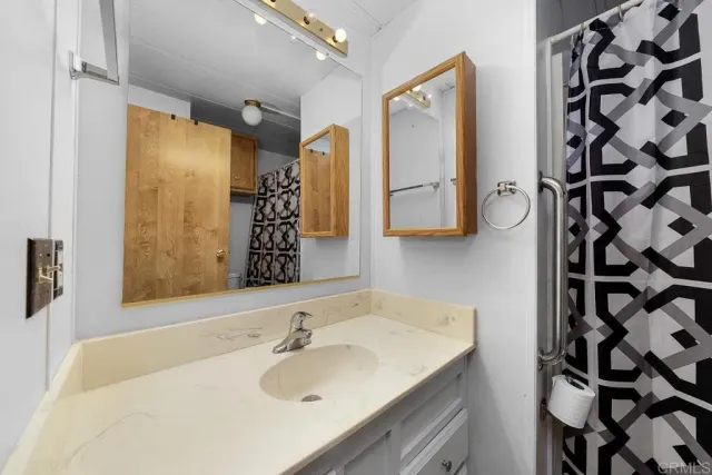 a bathroom with a sink and a mirror