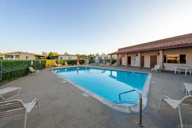 a view of a patio with swimming pool