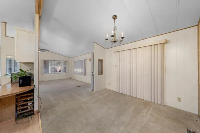 a view of a livingroom with furniture and chandelier