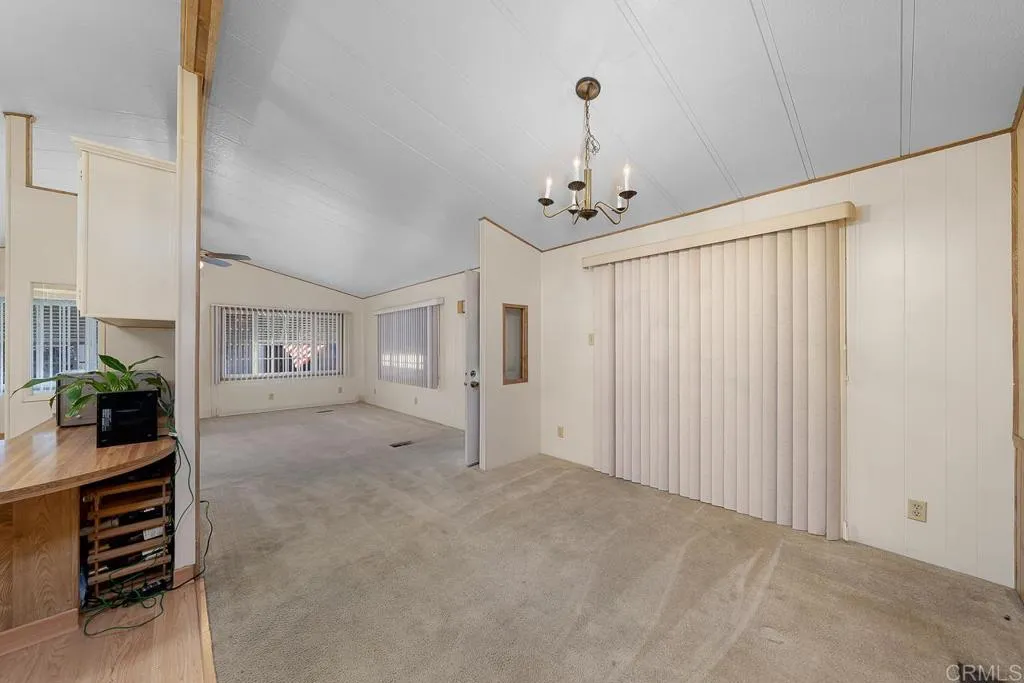11949 Riverside Drive, Unit 133 Lakeside, CA 92040 - Photo 6 of 28 a view of a livingroom with furniture and chandelier