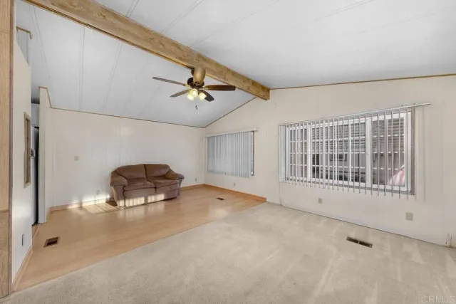 a view of a livingroom with furniture and windows