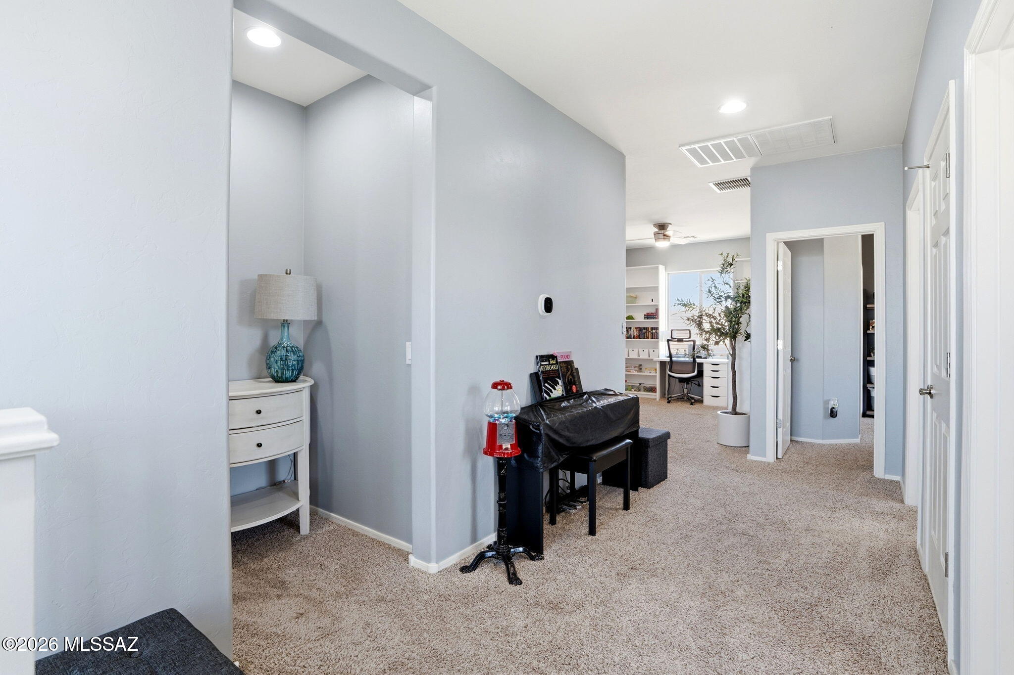 211 East Refuge Loop Vail, AZ 85641 - Photo 15 of 48 a view of a hallway with couch and a workspace