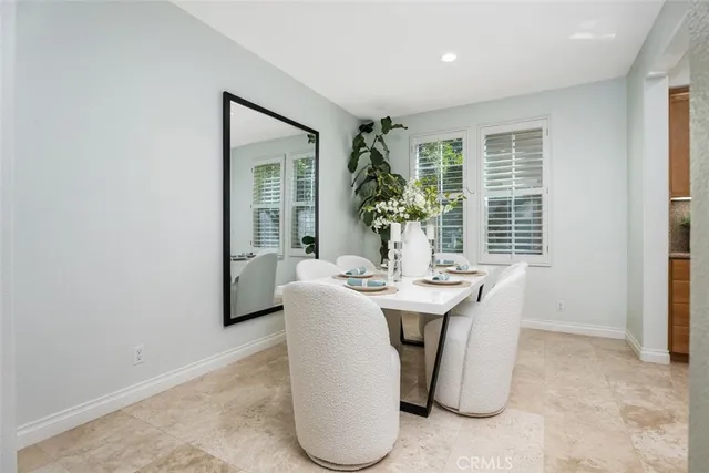 a view of a dining room with furniture window and outside view