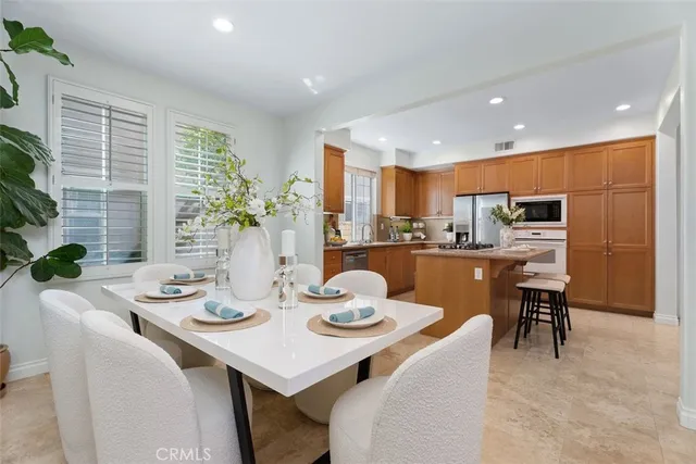 a kitchen with a table and chairs in it