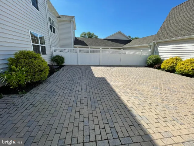 a view of an empty room with a fireplace
