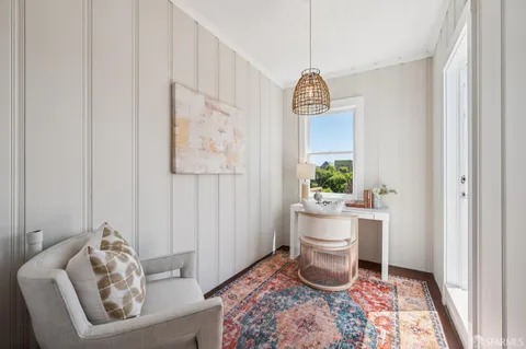 a bedroom with a bed and lamp