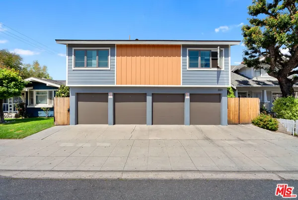 a front view of a house with a garage