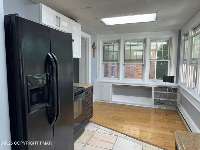 a view of walk in closet and window