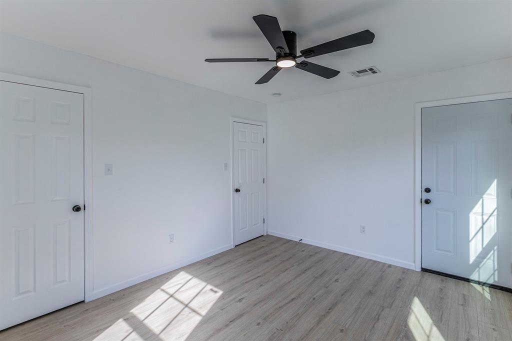 1026 La Clede Street Bellmead, TX 76705 - Photo 14 of 27 a view of a big room with wooden floor closet and windows