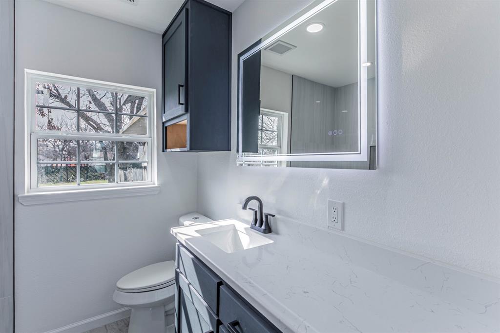 1026 La Clede Street Bellmead, TX 76705 - Photo 15 of 27 a bathroom with a sink and a toilet
