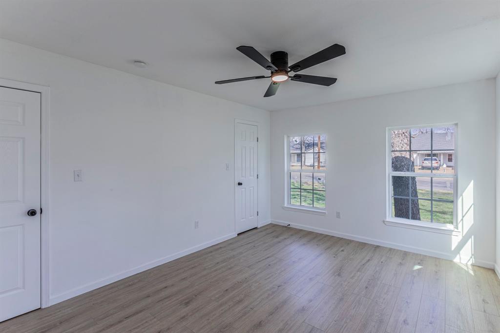 1026 La Clede Street Bellmead, TX 76705 - Photo 18 of 27 a view of empty room with wooden floor and fan