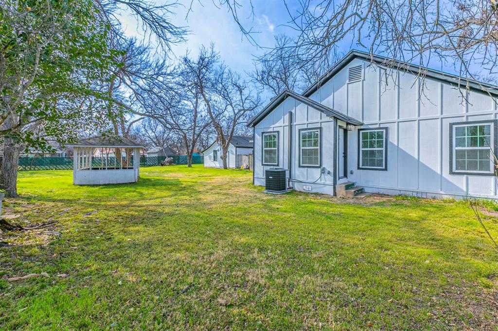 1026 La Clede Street Bellmead, TX 76705 - Photo 25 of 27 a view of a house with a yard and sitting area