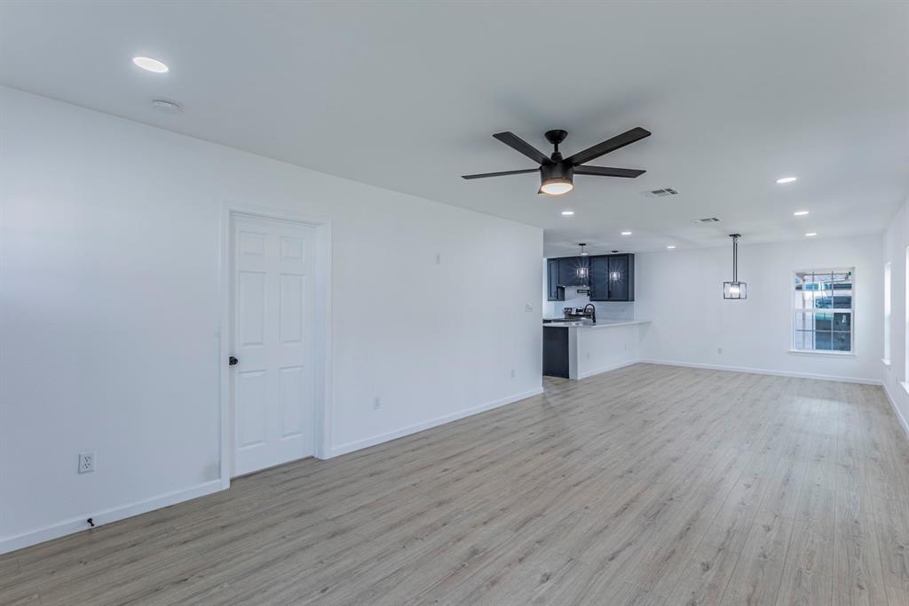 1026 La Clede Street Bellmead, TX 76705 - Photo 3 of 27 a view of a kitchen with a sink and a refrigerator