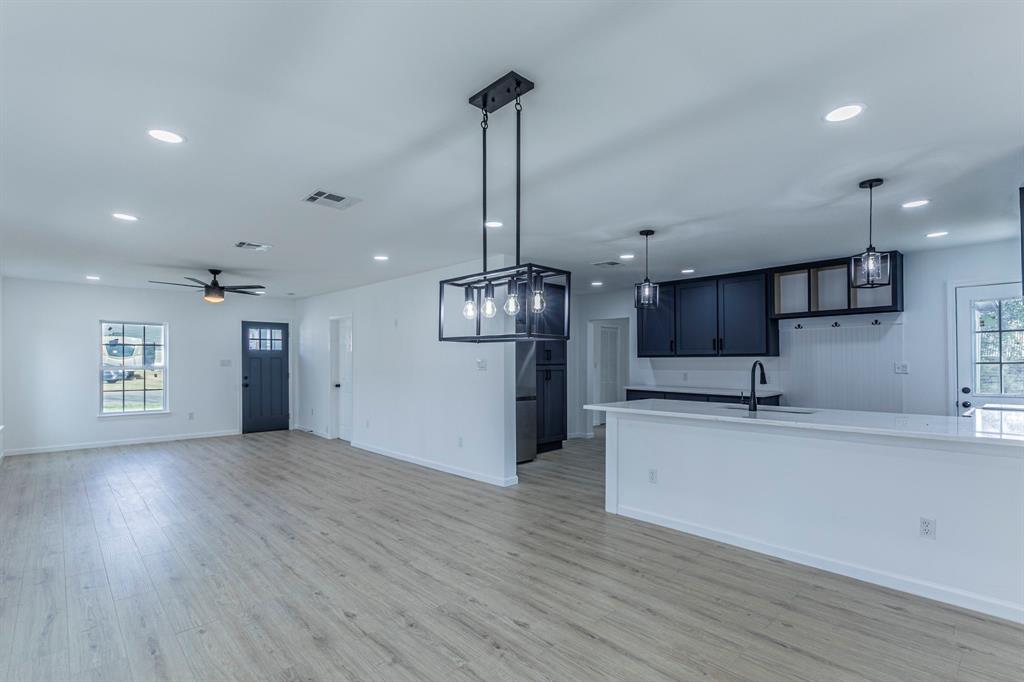 1026 La Clede Street Bellmead, TX 76705 - Photo 26 of 27 a view of a kitchen with a sink stainless steel appliances and cabinets