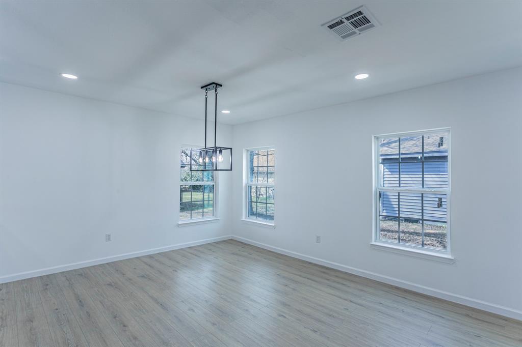 1026 La Clede Street Bellmead, TX 76705 - Photo 8 of 27 a view of an empty room with wooden floor and a window