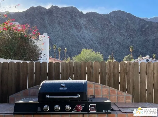 a front view of a house with outdoor seating