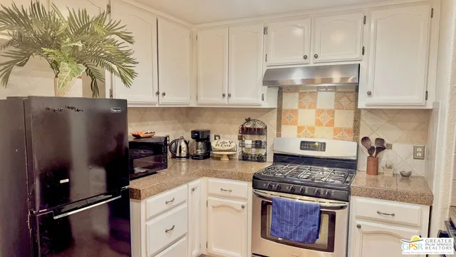 a spacious bedroom with a bed and a couch