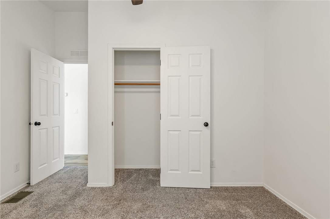 3534 Eloy Road Golden Valley, AZ 86413 - Photo 22 of 58 Unfurnished bedroom featuring carpet flooring and a closet