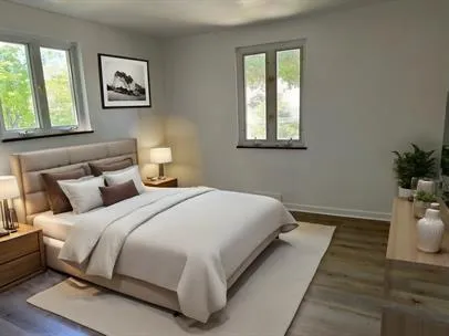 a bedroom with a large bed and a window