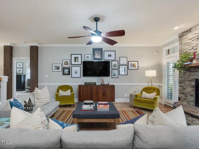 a kitchen with stainless steel appliances granite countertop a stove top oven a sink and white cabinets