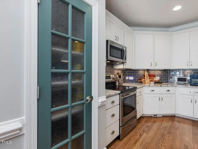 a view of entryway with wooden floor