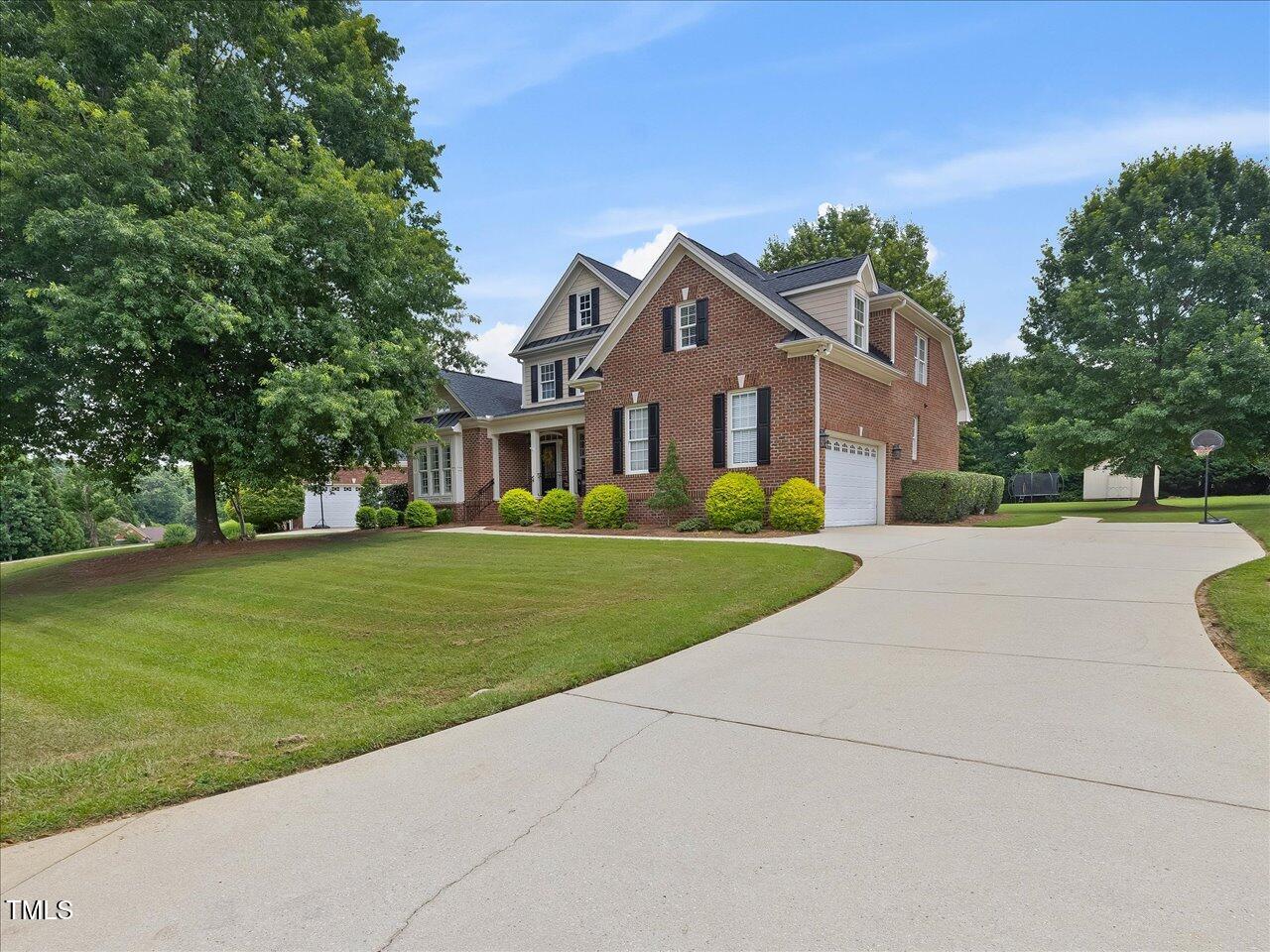 9045 Chelsea Drive Raleigh, NC 27603 - Photo 3 of 67 88-Driveway