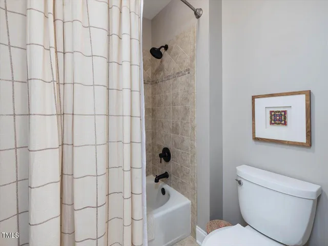 a big yard with lots of green space and plants