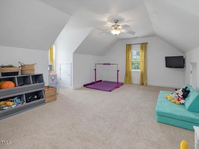 an aerial view of a house with pool yard and outdoor seating