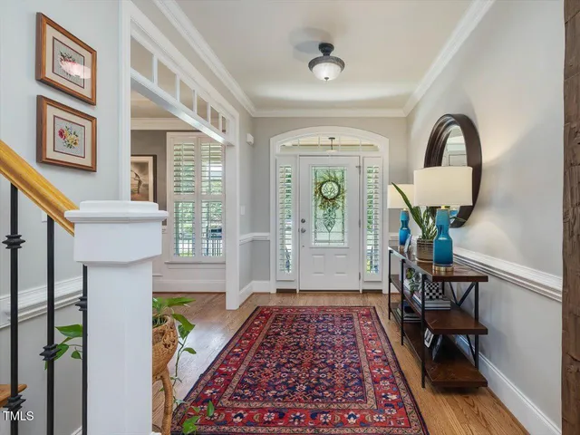 a living room with furniture or wooden floor and a fireplace