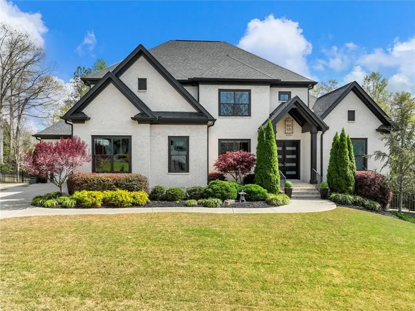 a front view of a house with a yard
