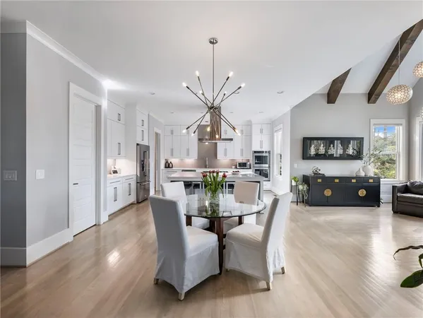 a bedroom with furniture and a flat screen tv