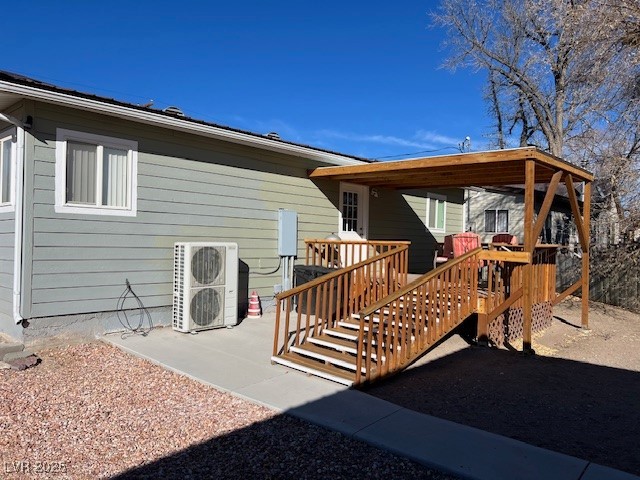 944 Main Street Panaca, NV 89042 - Photo 2 of 24 Rear view of property with ac unit and a deck
