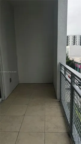 a view of a kitchen with kitchen island and a sink