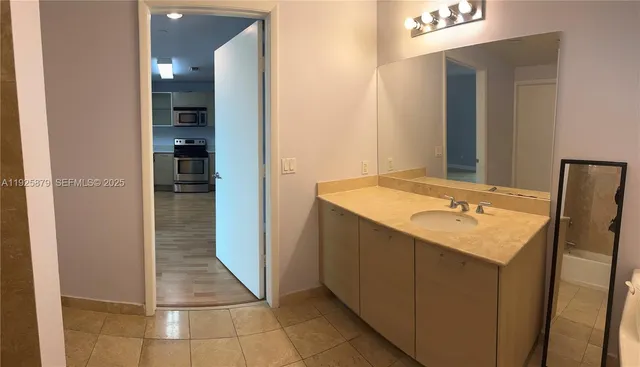 a bathroom with a sink and a mirror